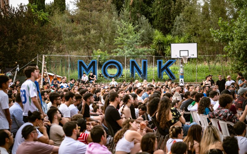 people sitting in basketball field with countryside in the background at monk roma xceed